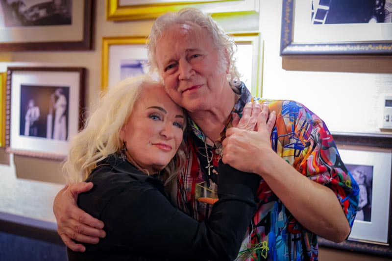 Grand Ole Opry members Tanya Tucker and T. Graham Brown backstage at the Grand Ole Opry. (Photo Credit: Rebekah Speer)