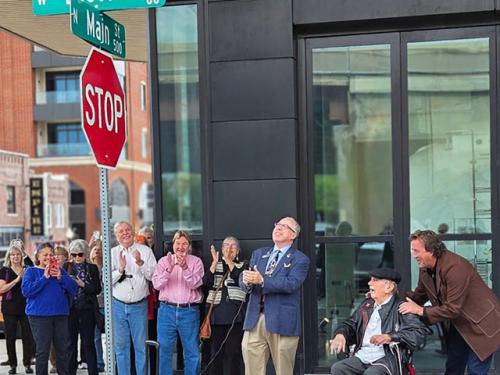 Jim Halsey (seated) celebrates the unveiling of Jim Halsey Way at North Main Street and West Easton Street on Oct. 15, 2026
