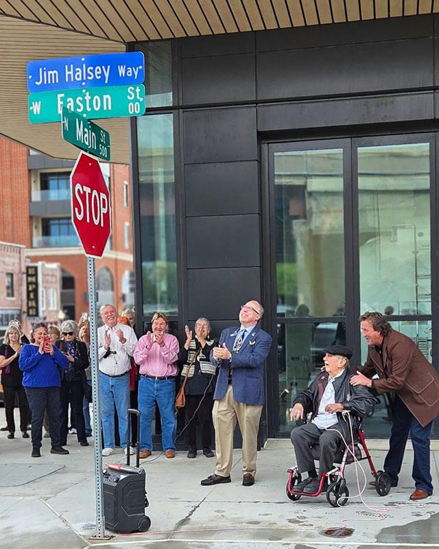 Jim Halsey (seated) celebrates the unveiling of Jim Halsey Way at North Main Street and West Easton Street on Oct. 15, 2026